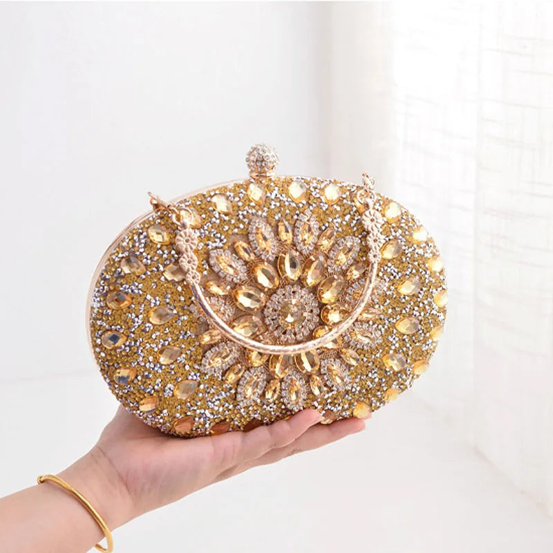 Sparkle at any event with our Flower Diamond Clutch. Luxury meets style with a metal handle and chain for added elegance