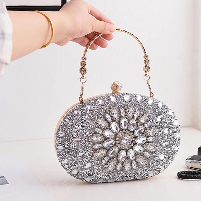 Sparkle at any event with our Flower Diamond Clutch. Luxury meets style with a metal handle and chain for added elegance